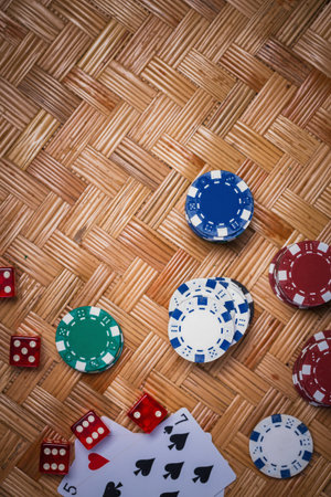 Poker Chips in casino gamble green table.