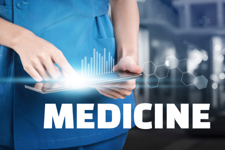Nurse touch her tablet with Medicine text display.の写真素材