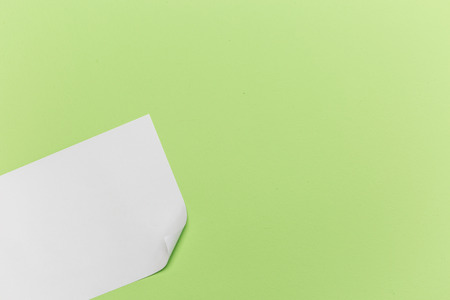 Top view white paper on green background.の写真素材