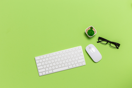 Office Desk with Keyboard Mouse Man hand using from above view.の写真素材