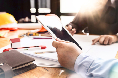 Construction engineering meeting at workplace office working hard modern design new plan on their project architecture concept.の写真素材