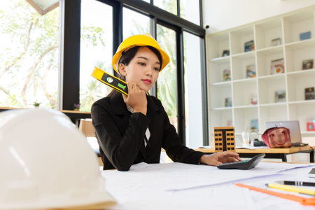 Business engineer working hard at construction site office workplace.の写真素材
