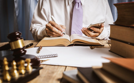 The private office of an Asian young lawyer who is currently working on financial information in...