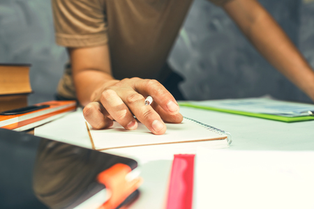 A man working hard at his office, he is own small business of work at home concept.の写真素材