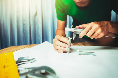 Working hard of a businessman factory engineer in office main worktable mechanical zone.の写真素材