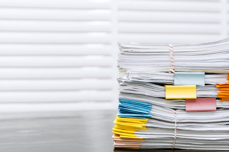 Paperwork pile print document unorganized put on the desk.