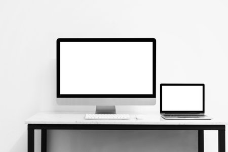 Mock up computer and desktop for your advertise modern technology concept.