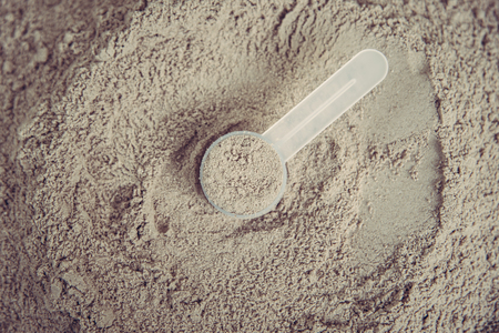 Double chocolate whey protein powder scoop nutrition healthy food bodybuilding.の写真素材