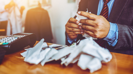 Middle-aged man business expense bills in the office, asian people.の写真素材