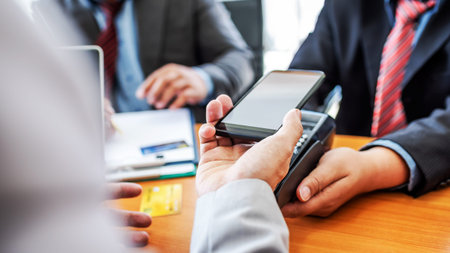 Customers paying bill financial quick cash by NFC payment pos technology with mobile app in...