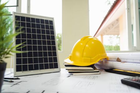 Desk of architects Solar Energy Powered Home Green for reduce global warming concept.の写真素材