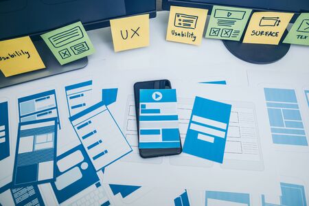 Developing wireframe UX/UI mobile application design for mobile user experience.の写真素材