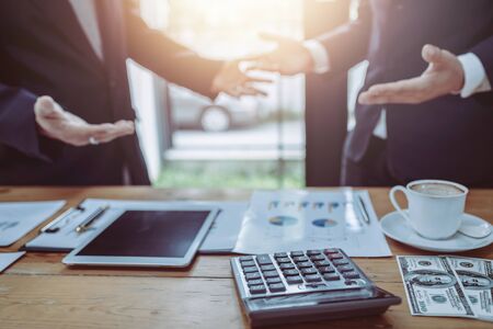 Young business people working together in meeting room at office desk.の写真素材