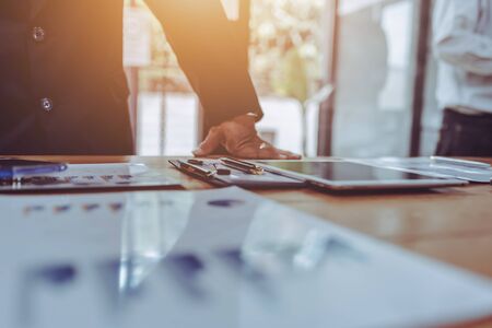 Young business people working together in meeting room at office desk.の写真素材