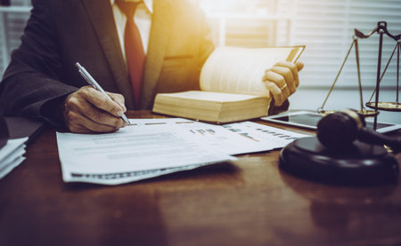 Middle-age of male lawyer working with legislation contract paper in courtroom, attorney justice and...