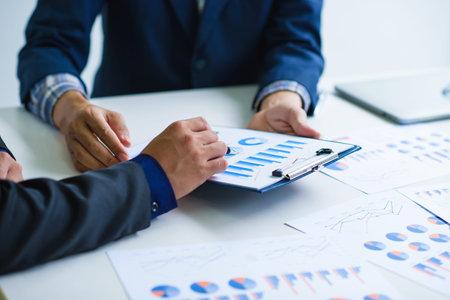 Group of business people busy discussing financial matter during meeting in the office.の写真素材