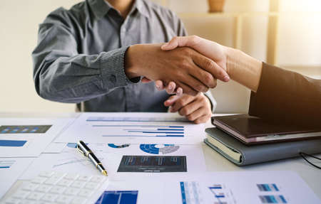 handshake gestures people connect concept, Business negotiation, happy business woman shaking hands at work, enjoying with colleagues.の写真素材