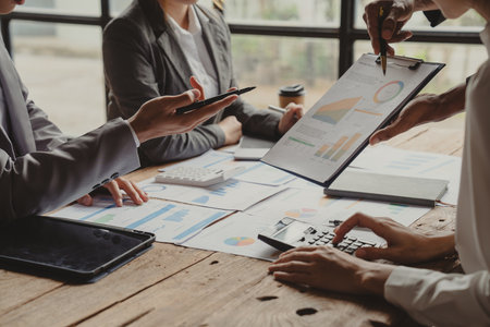 Close up.business colleagues discussing new opportunities, plan refers to a set of agreements that guide a closely.の写真素材