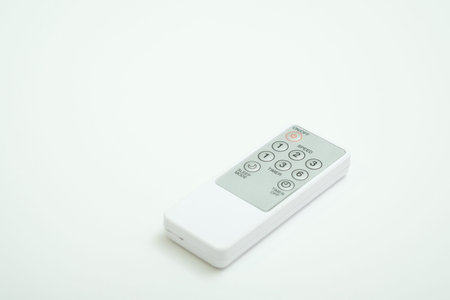 Universal remote control shot on isolated white plain background.