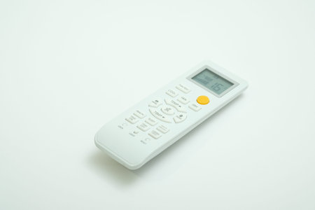 Universal remote control shot on isolated white plain background.