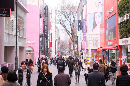 MYEONGDONG, SEOUL - 27th March 2019 : Pedestrians , locals, foreigners and tourist walking the the...