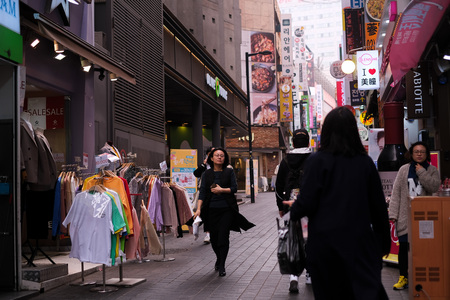 MYEONGDONG, SEOUL - 27th March 2019 : Pedestrians , locals, foreigners and tourist walking the the street of Myeongdong, one of Seoul most visited district.のeditorial素材