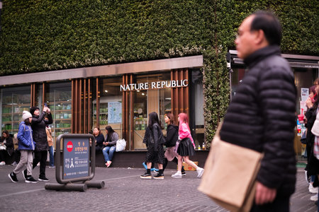 MYEONGDONG, SEOUL - 27th March 2019 : Pedestrians , locals, foreigners and tourist walking the the...