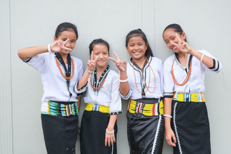KOTA KINABALU, SABAH, MALAYSIA  - Jun 17, 2019: Pupils wearing traditional attire of lundayeh, or...