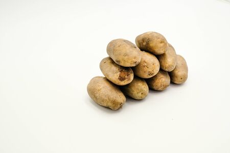 Potatoes or Solanum tuberosum, shots on isolated white background.の写真素材