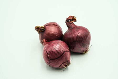Red onion or Allium cepa, shots on isolated white background.の写真素材