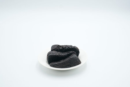 chocolate moist cake shot on a white isolated background.