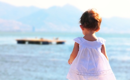 Little girl watching sea の写真素材