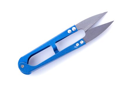blue scissors for sewing and needlework on a white isolated background. view from aboveの写真素材