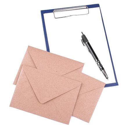 Mail envelopes and a blank for filling with a pen on a white isolated background. mail or delivery conceptの写真素材