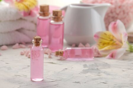 Spa composition with cosmetic aroma oils closeup. spa concept. on a light background.の写真素材
