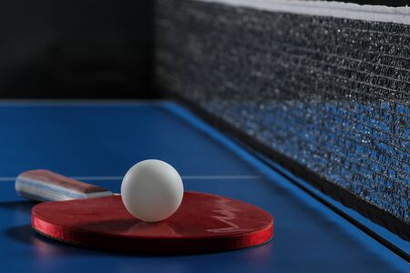 table tennis. Accessories for table tennis racket and ball on a blue tennis table. Sport. Sport game.の写真素材