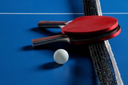table tennis Accessories for table tennis racket and ball on a blue tennis table. Sport. Sport game.の写真素材