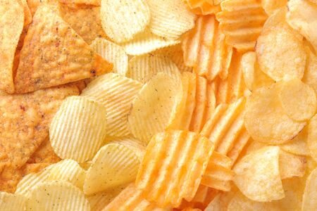 Background from different chips close-up. Snacks. unhealthy food.の写真素材