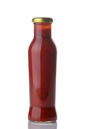 Red sauce in a bottle on a white isolated background. Tomato sauce. Ketchupの写真素材