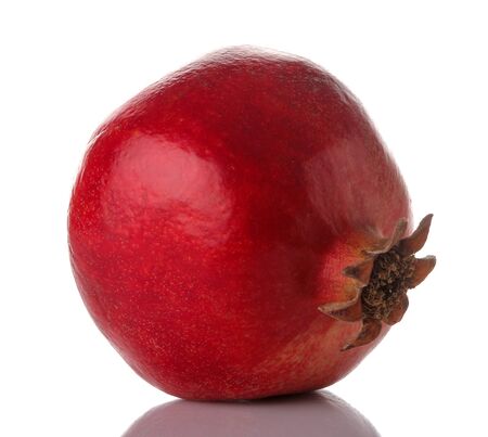 Big red pomegranate fruit close up on white isolated backgroundの写真素材