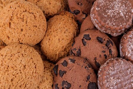 Background from different sweet cookies. Oatmeal cookies and chocolate. top view close upの写真素材