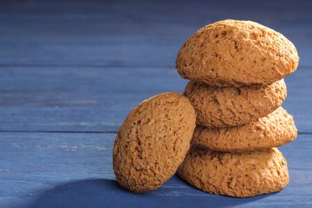 oatmeal cookies piled in a pile on a blue wooden table. bake. tasty planの写真素材