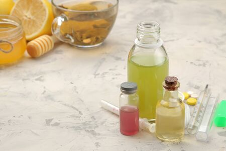 Various medicines for flu and cold remedies on a white wooden table .. Cold. diseases. cold. flu.の写真素材