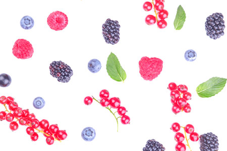 Various fresh berries close-up including blueberries, raspberries, blackberries and currants on a...