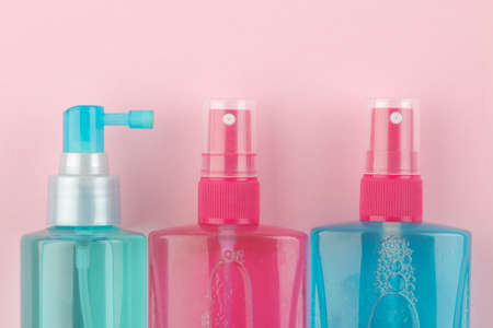 Various hair care products on a bright pink background. hair cosmetics. top view with space for textの写真素材