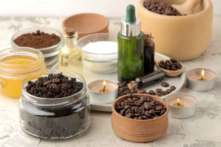 homemade coffee scrub in a jar for the face and body, and various ingredients for making scrub on a light background. spa. cosmetics. care cosmetics.の写真素材