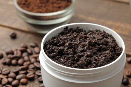 homemade coffee scrub in a white jar for the face and body and various ingredients for making scrub. spa. cosmetics. care cosmeticsの写真素材