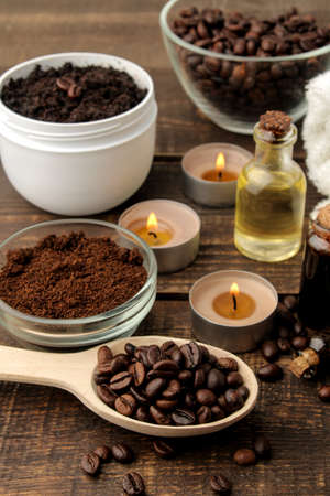 homemade coffee scrub in a white jar for the face and body and various ingredients for making scrub. spa. cosmetics. care cosmeticsの写真素材
