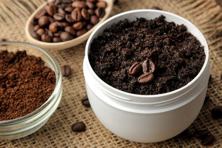 homemade coffee scrub in a white jar for the face and body and various ingredients for making scrub. spa. cosmetics. care cosmeticsの写真素材