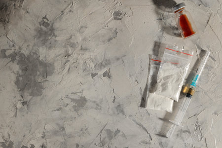 addictive drugs. heroin and cocaine are not light concrete background. The concept of drug...
